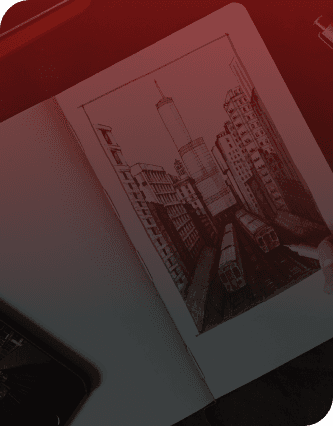 a drawing of a city on a notebook