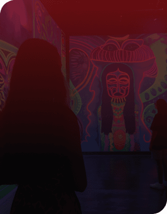 a woman looking at a painting in a museum